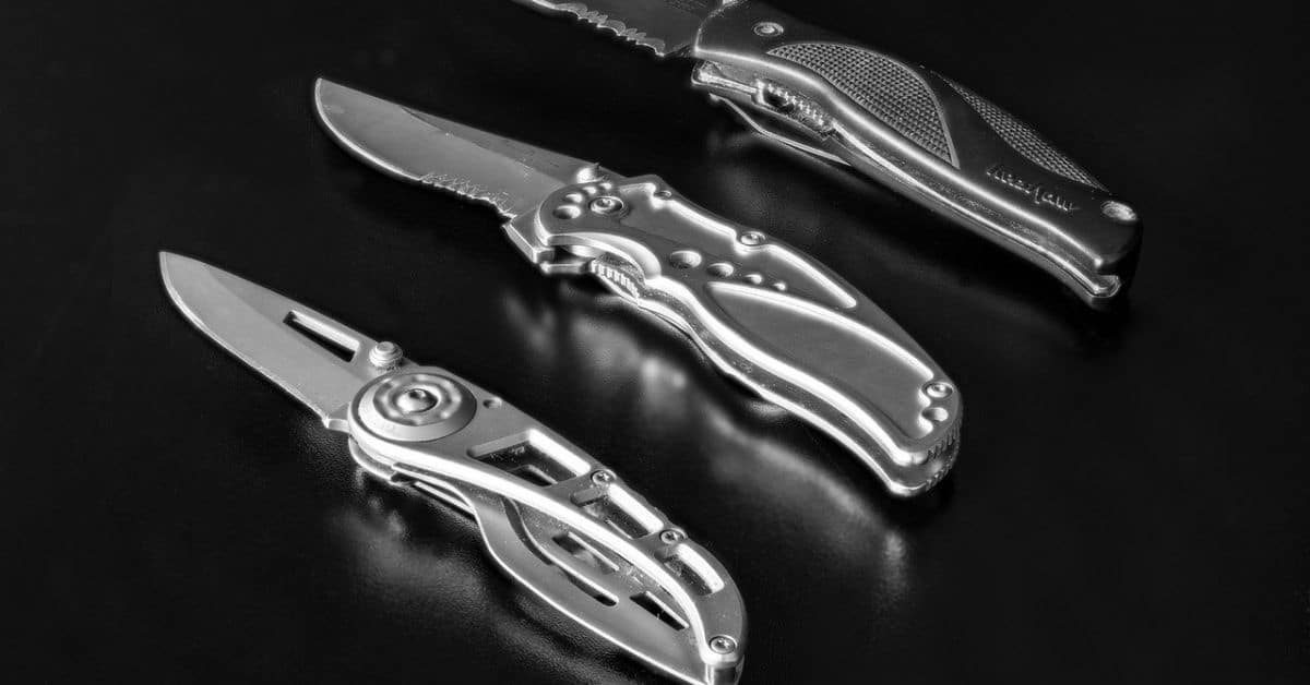 Three open pocket knives