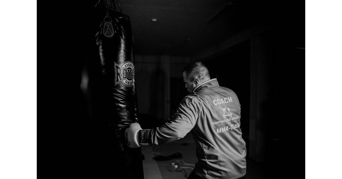 A boxer punching a punching bag