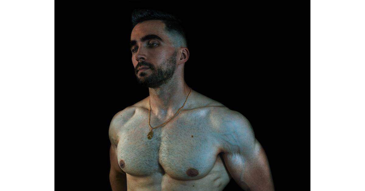 A shirtless muscular man